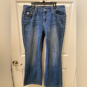 Women’s blue jeans with rhinestone buttons